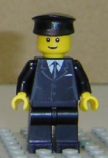 LEGO Minifigure-Suit Black, Black Police Hat, Male Thin Grin, Brown Eyebrows, Thin Grin-Town / City-CTY145-Creative Brick Builders